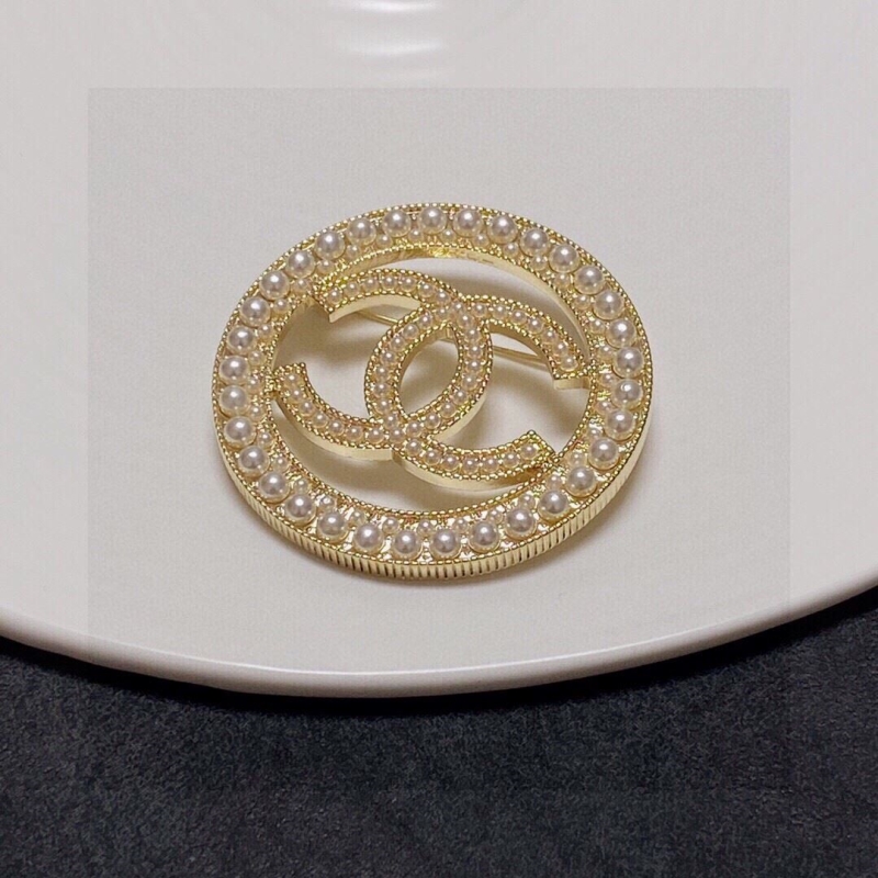 Ch*el brooches